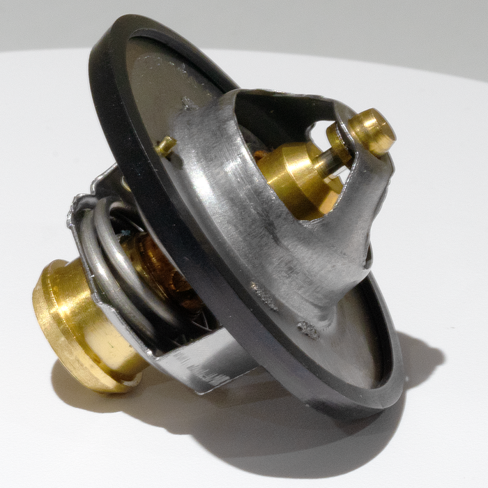 Side view of the 180-Degree Thermostat for RAM 6.4L engines, showcasing precision craftsmanship