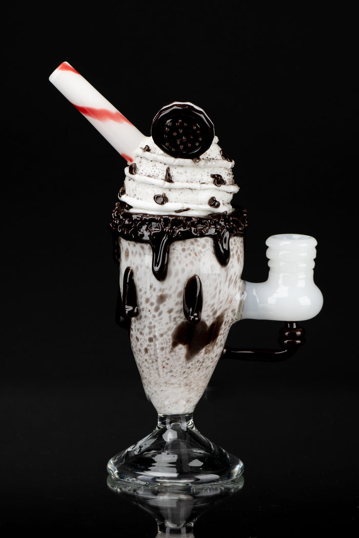 Glass pipe shaped like a chocolate sundae with whipped cream and a cherry on top.