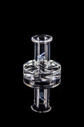 Clear glass dab rig with intricate design against a black background.