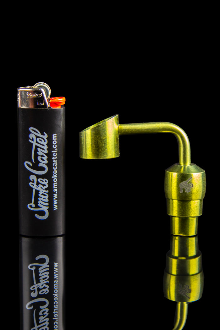 Close-up of a silver Honeybee Herb Titanium 2-In-1 Banger shown from the side against a black background with a lighter for scale.
