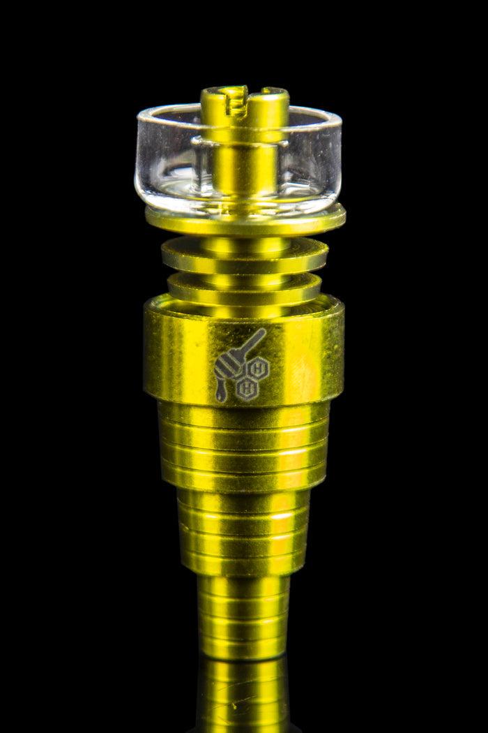 Gold-colored quartz banger for vaporizing cannabis concentrates.