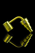 Gold cannabis dab rig with mirrored reflection.