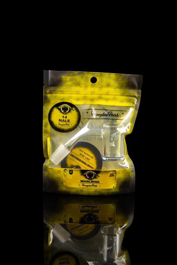 A sealed, metallic yellow bag of “Honeybee Herbs” cannabis, stacked with a similar bag below, against a black background.