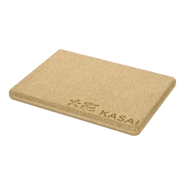 A beige rectangular heat mat with the brand 'Kasai' printed on it.