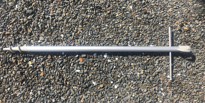 Lower replacement pole for 210cm umbrellas lying on gravel surface