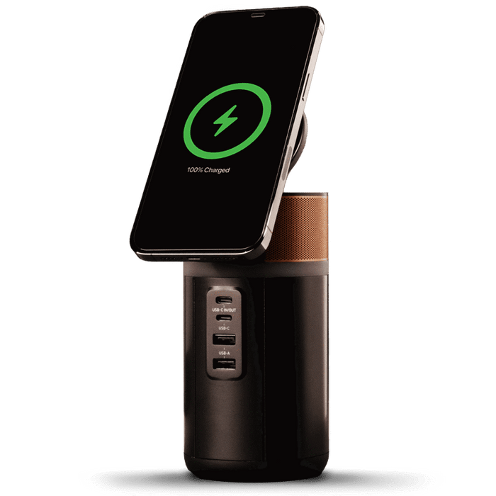 Image of the power station with a phone wirelessly charging on top and the lid tilted up.