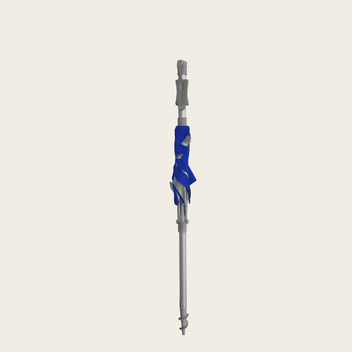 Maxibrella Beach Umbrella folded with Quik Twist self-anchoring auger and Sunraker table pole features
