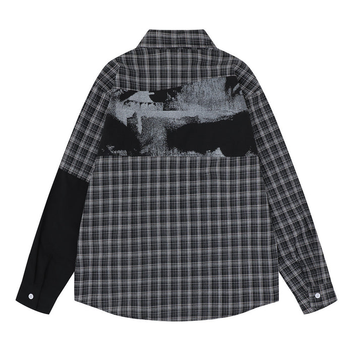 Back view of the black plaid patchwork shirt with a grayscale graphic panel across the upper back