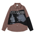 Front view of the red plaid shirt with black patchwork panel, City Desire text, and grayscale face graphics