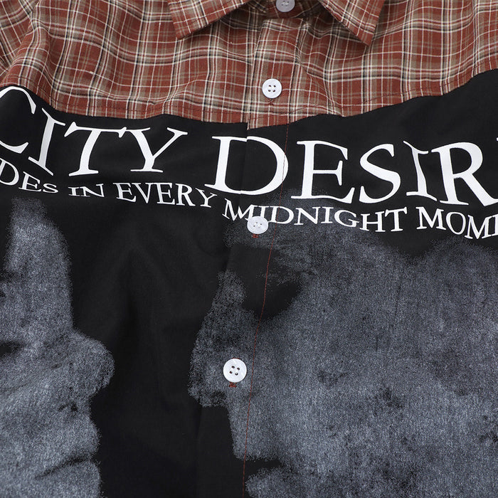 Close-up of the shirt front showing white City Desire lettering, plaid fabric, buttons, and grayscale face graphics