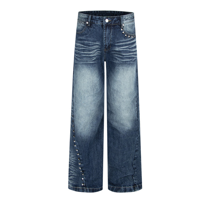 Men's wide-leg dark blue washed denim jeans with pyramid stud trim along the pocket and outer leg seam, front and back view