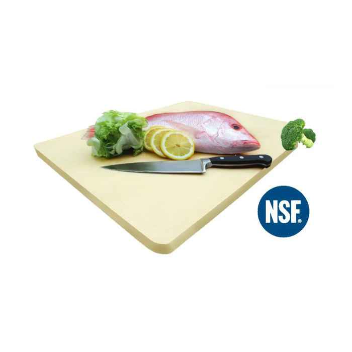 A beige rubber cutting board, 18 x 12 inches, with a knife and some food items like lemon and lettuce on top of it.
