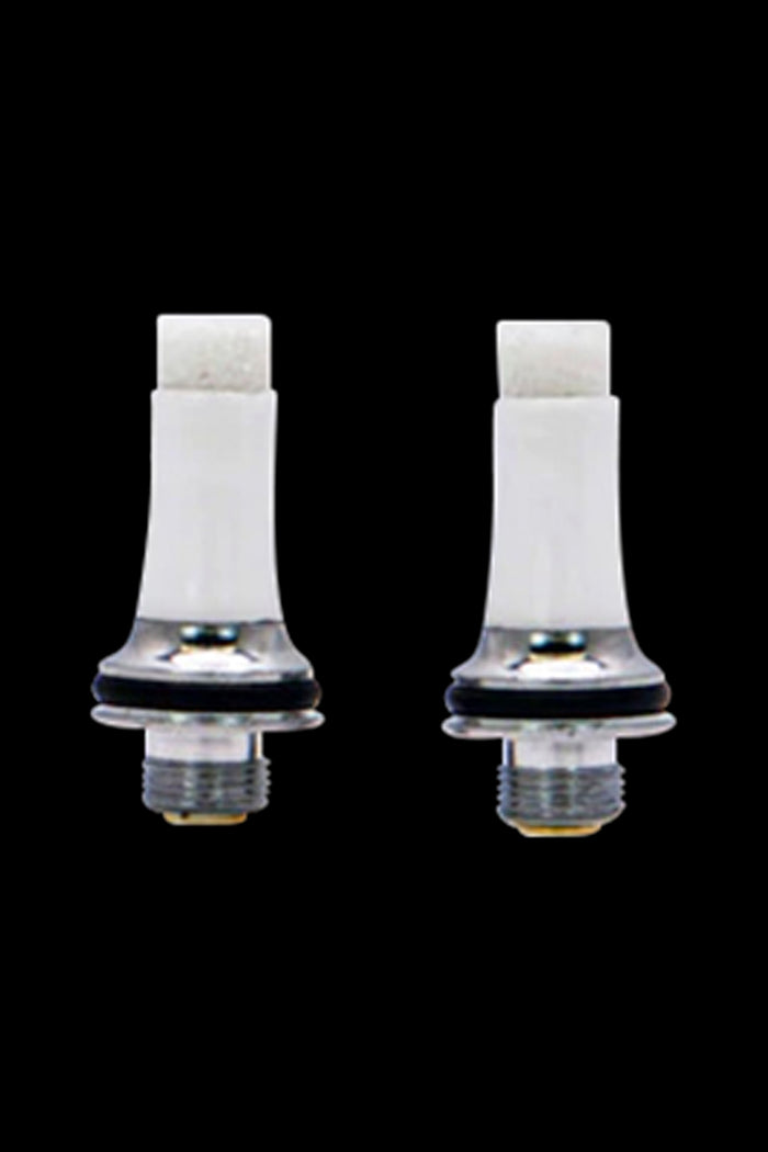 Two white cannabis vape cartridge attachments against a black background.