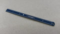 Blue Titanion Pocket Ruler 6 inch or 15cm on tabletop.