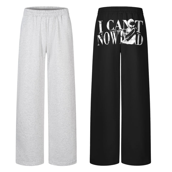 Wide-leg graphic print sweatpants in black with distressed 'I Can't Now' letter and figure print on the back panel